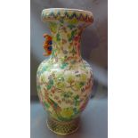 A large Chinese famille rose vase decorated with flora and fauna,