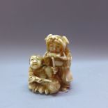 A Japanese Meiji ivory netsuke, modelled as figures with instruments, H.