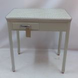 A grey painted pine kitchen table with checkered formica top and single drawer.