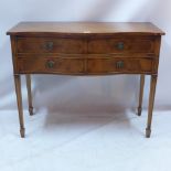 A Georgian style yew wood side table with serpentine front,