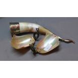 Two mother of pearl candle sconces in the form of shells together with a white metal mounted horn.