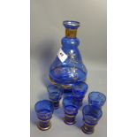 Middle eastern blue glass carafe with matching glasses,