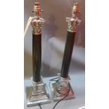 A pair of silver plated and black marble Corinthian column table lamps (wired and recently PAT