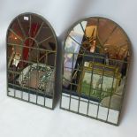 A pair of arch top metal framed garden mirrors