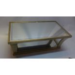 A contemporary gilt framed two tier coffee table with mirrored tiers,