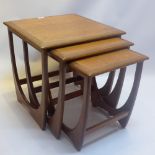 A teak G-plan nest of three tables