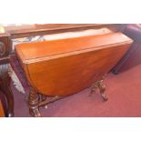 A Victorian mahogany Sutherland table raised on cabriole legs and castors