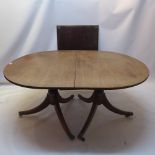 A 19th Century mahogany D-End dining table raised on balloter supports and six splayed legs,