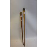 A 18ct gold mounted walnut walking stick together with one other.