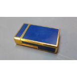 A Dupont lighter, blue enamelled and gilt metal design,