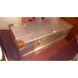An aviator style trunk with hinge lid above single drawer,