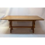 A 20th Century oak refectory table on trestel base.