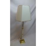 An Italian designer brass standard lamp having Corinthium column with perspex support and original