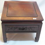 A Chinese hardwood bedside table with single drawer,