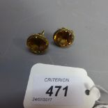 A pair of yellow gold and citrine set earrings