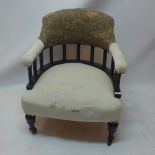 A Victorian ebonised arm chair with part William Morris upholstery raised on turned legs and