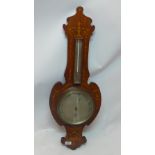 A Edwardian mahogany barometer, inlaid with scrolling foliate design, H.