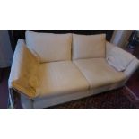 A contemporary beige two seater sofa Length 178cm x 68cm D: 98cm