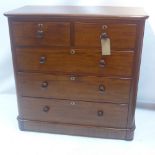 A Victorian mahogany chest of two short over three long drawers, raised on dun feet.