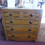 A Victorian painted pine chest of two short over three long drawers, raised on bracket feet.