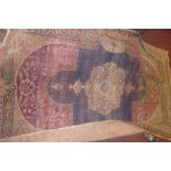 North West Persian rug, floral tear drop medallion to centre over faded indigo ground, within red,