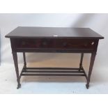 An Edwardian mahogany side table with two drawers above lower tier,