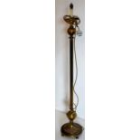 Brass standard lamp standing on circular base with reeded shaft