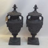 A large pair of painted plaster garden urns in the classical taste