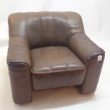 A de seoe DS44 brown leather arm chair with extendable seat.