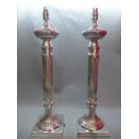A pair of silver plated reeded column style table lamps. H.