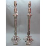 A pair of Empire style silver plated table lamps. H.