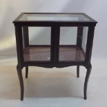 A 19th Century mahogany bijouterie cabinet raised on cabriole legs,