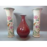 A pair of 18th century Chinese trumpet vases, famille rose design, H.