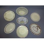 A collection of cream ware plates.