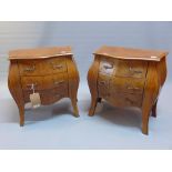 A late 19th/early 20th century pair of miniature walnut bombe commodes. H.