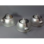 A set of three silver industrial lamps. Diameter.
