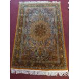 Indian carpet, honey tear drop medallion to centre over floral ground and border,