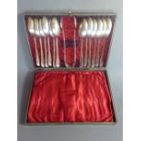 A cased set of 12 silver tea spoons, London 1870, maker 'G.A', together with silver sugar tongs.
