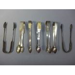 A collection of 7 silver sugar tongs, assortment of different hallmarks. Approx.260g.