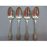 A pair of silver serving spoons, fiddle and thread style with shell decorative and lion,
