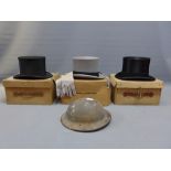 Three boxed top hats and a women's hat