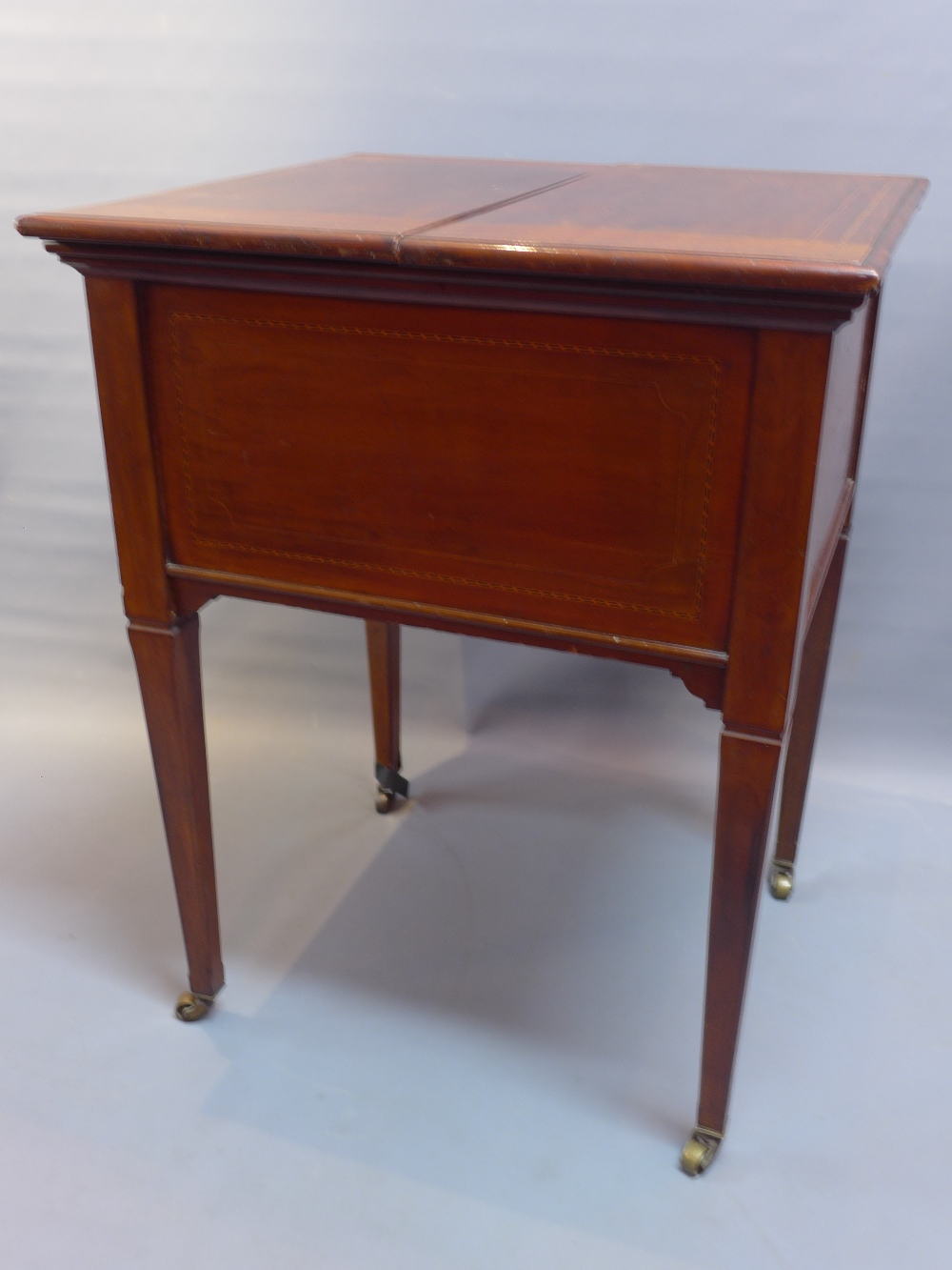 An Edwardian mahogany boxwood inlaid, tantalus drinks/ cocktail cabinet,