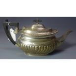 A silver tea pot, London 1911/12, maker 'H & C', retailed by Hamilton & Co, Calcutta. H.