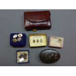 A collection of gentleman's cufflink's and dress studs, along with a tie pin,