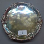 A 19th century silver salver, London. D.18cm approx.