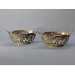 A pair of silver Dutch bon bon dishes, twin handled with pierced decoration, marked 'VK' Approx.