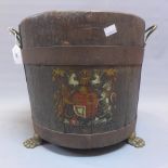 A late 19th century oak ships barrel with a Royal Crest raised on paw feet. H.