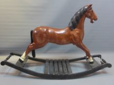 An early 20th century hand painted carved wooden rocking horse.