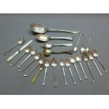 A collection of silver spoons with various hallmarks to include Sheffield and Birmingham with a