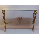 A French designer console table, with mirrored top over scrolling gilt metal base,